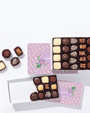 A box of chocolates with "Happy Mother's Day" message being filled with chocolates